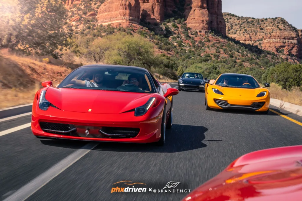 Ferrari 458 and McLaren MP4-12C driving through Sedona red rocks with PHXDriven