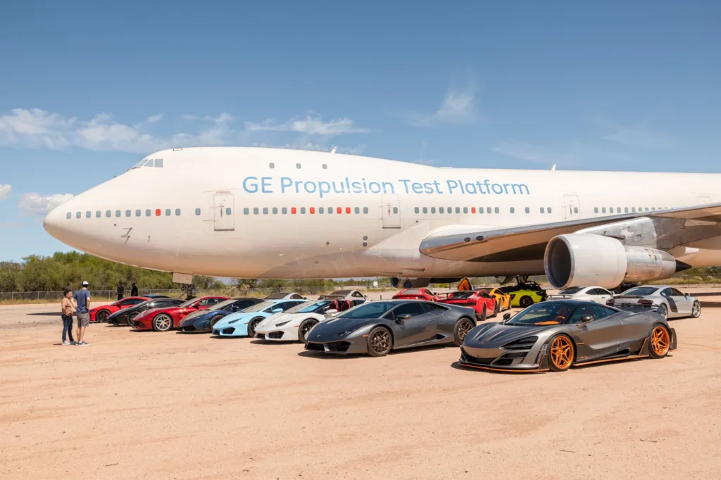 PHXDriven supercars lined up beside a Boeing 747 at the Pima Air & Space Museum